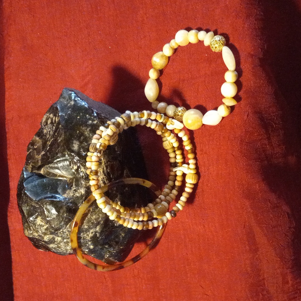 3 bracelet bundle. One resin tortoise shell pattern. One resin bead. One natural